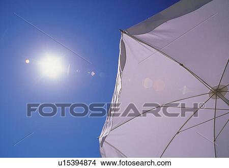 Picture -  a White Sunshade, the Sun Shining Upon It, Low Angle View, Lens Flare. Fotosearch