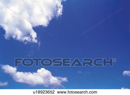 Several Clouds Floating in the Blue Sky, Low Angle View, Copy Space View Large Photo Image Stock Image - Several Clouds Floating in the Blue Sky, Low Angle View, Copy Space. Fotosearch