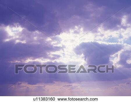Several Clouds, Sunbeams Shining Through, Low Angle View View Large Photo Image Stock Image - Several Clouds, Sunbeams Shining Through, Low Angle View. Fotosearch