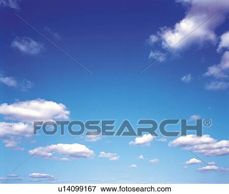Stock Photo -  Several Small Clouds Floating in the Light Blue Sky, Low Angle View. Fotosearch