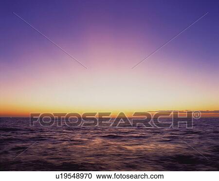 the Ocean in the Evening, the Horizon Orange From the Setting Sun, Front View, Copy Space View Large Photo Image Stock Image - the Ocean in the Evening, the Horizon Orange From the Setting Sun, Front View, Copy Space. Fotosearch