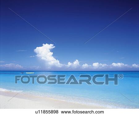 the Ocean with Transparent and Light Blue Water Under a Blue Sky, Side View View Large Photo Image Stock Photo - the Ocean with Transparent and Light Blue Water Under a Blue Sky, Side View. Fotosearch