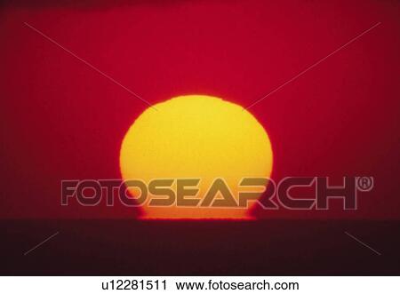 the Sun By Sunset at Sea, the Sky Reflecting the Colors of the Sun, Front View View Large Photo Image Stock Image - the Sun By Sunset at Sea, the Sky Reflecting the Colors of the Sun, Front View. Fotosearch