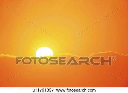 the Sun Going Down Behind Some Clouds, the Sky Reflecting the Colors of the Sun, Front View, Copy Space View Large Photo Image Stock Photo - the Sun Going Down Behind Some Clouds, the Sky Reflecting the Colors of the Sun, Front View, Copy Space. Fotosearch