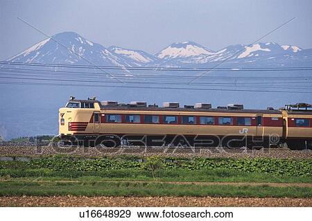Stock Photo - Mt. Hakkouda and Limited Express Train. Fotosearch