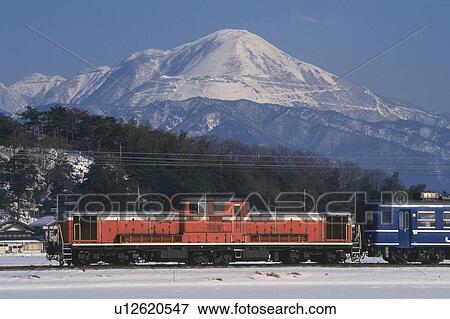 Stock Photo - Mt. Ibuki and Local Train. Fotosearch