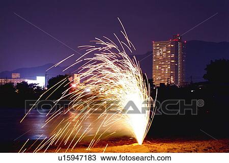 Stock Image - Firework on beach, long exposure. Fotosearch