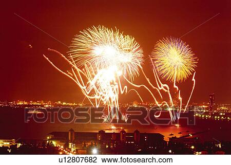 Stock Image - Fireworks exploding in sky, long exposure. Fotosearch