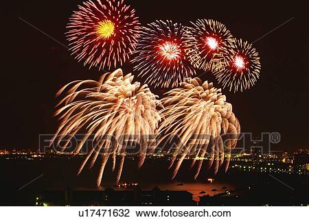 Stock Image - Fireworks exploding in sky, long exposure. Fotosearch
