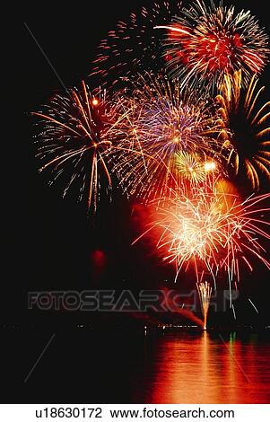 Stock Image - Fireworks exploding in sky, long exposure. Fotosearch