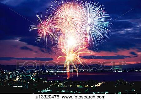 Stock Photograph - Fireworks exploding in sky, long exposure. Fotosearch
