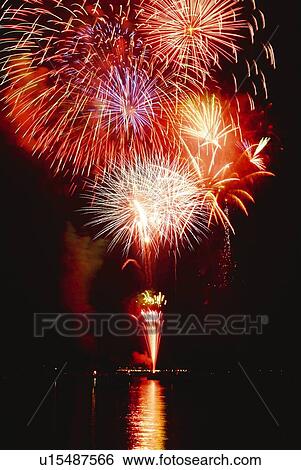 Stock Photograph - Fireworks exploding in sky, long exposure. Fotosearch
