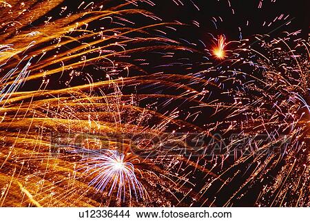 Fireworks exploding in sky, low angle view, long exposure View Large Photo Image Picture - Fireworks exploding in sky, low angle view, long exposure. Fotosearch