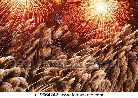 Fireworks exploding in sky, low angle view, blurred motion, long exposure View Large Photo Image Stock Image - Fireworks exploding in sky, low angle view, blurred motion, long exposure. Fotosearch