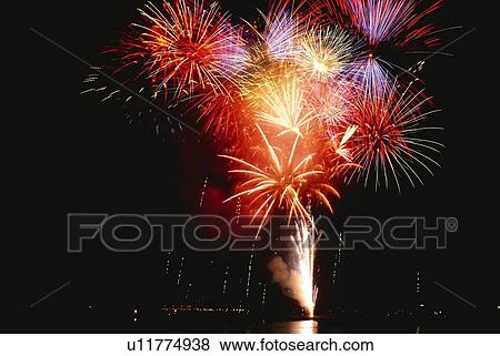 Fireworks exploding in sky, low angle view, long exposure View Large Photo Image Stock Photo - Fireworks exploding in sky, low angle view, long exposure. Fotosearch