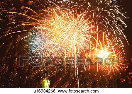 Fireworks exploding in sky, low angle view, long exposure View Large Photo Image Stock Photograph - Fireworks exploding in sky, low angle view, long exposure. Fotosearch