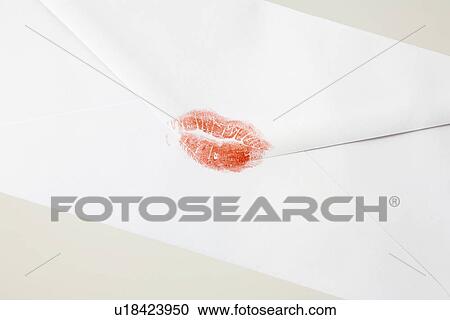 Stock Image - Envelope sealed with lipstick kiss (close-up). Fotosearch