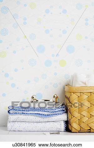 Rattle on stack of towels View Large Photo Image Stock Photography - Rattle on stack of towels. Fotosearch