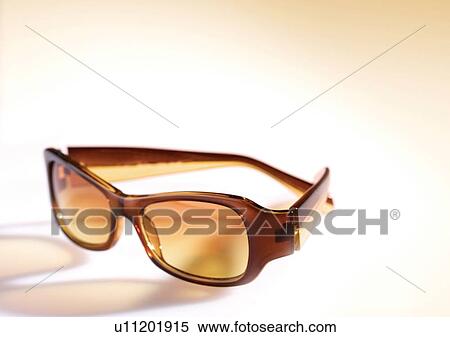 Stock Photography - eye glasses, sun glasses, brown, reflection. Fotosearch