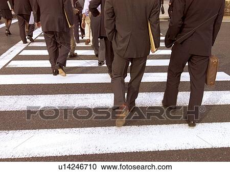Stock Image - Businessmen, Commuters, Crossing. Fotosearch