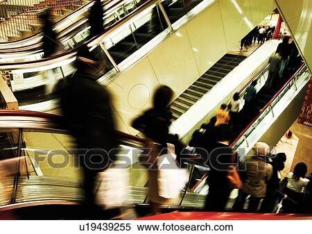 Stock Photography - Carrying, Holding, Escalator, Indoor. Fotosearch