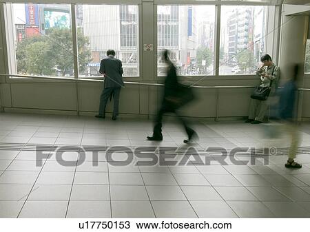 Stock Image - Walking, Group Of People, Indoor. Fotosearch