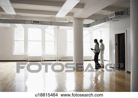 Picture - Architects planning in empty room. Fotosearch