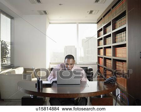 Businessman using laptop computer and laughing View Large Photo Image Picture - Businessman using laptop computer and laughing. Fotosearch