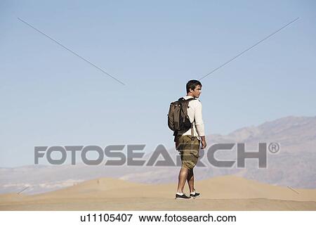 Male hiker near mountains View Large Photo Image Stock Photo - Male hiker near mountains. Fotosearch