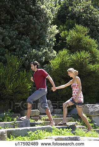 Young couple walking on ruins View Large Photo Image Stock Photo - Young couple walking on ruins. Fotosearch
