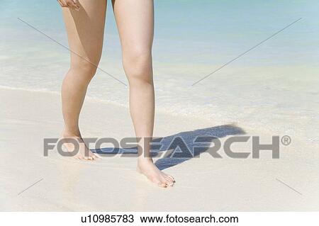 Woman walking on beach, Saipan, USA View Large Photo Image Stock Image - Woman walking on beach, Saipan, USA . Fotosearch