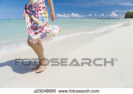 Young woman standing on beach, copy space, Saipan, USA View Large Photo Image Stock Image - Young woman standing on beach, copy space, Saipan, USA . Fotosearch