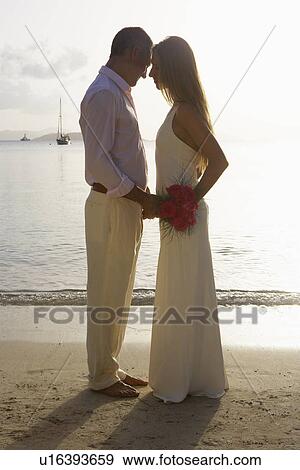 Stock Photo - Newlyweds on beach, St. John, US Virgin Islands, USA. Fotosearch