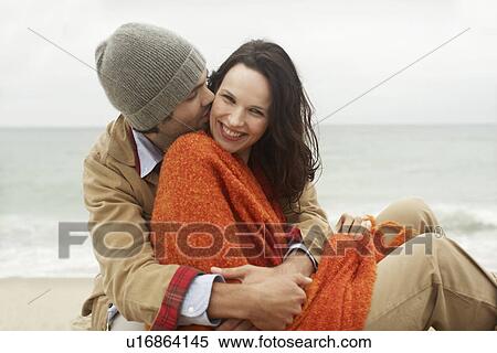 Stock Photography - Young couple at beach (portrait). Fotosearch