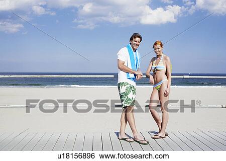 Young couple by railings at beach (portrait), Spring Lake, New Jersey, USA View Large Photo Image Stock Photograph - Young couple by railings at beach (portrait), Spring Lake, New Jersey, USA. Fotosearch