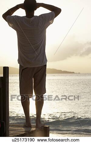 Young man looking at view View Large Photo Image Stock Image - Young man looking at view. Fotosearch