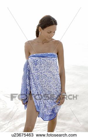 Young woman in sarong View Large Photo Image Stock Image - Young woman in sarong. Fotosearch