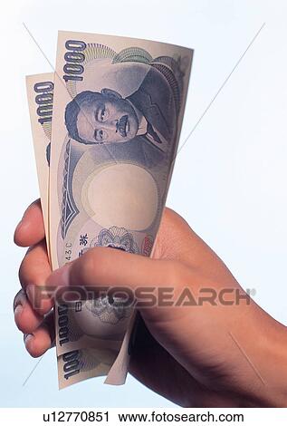 Stock Image - Close-Up, One Person, Two Objects. Fotosearch