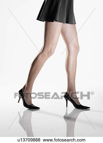 Woman in mini skirt and high heeled shoes (low section) View Large Photo Image Stock Photo - Woman in mini skirt and high heeled shoes (low section). Fotosearch