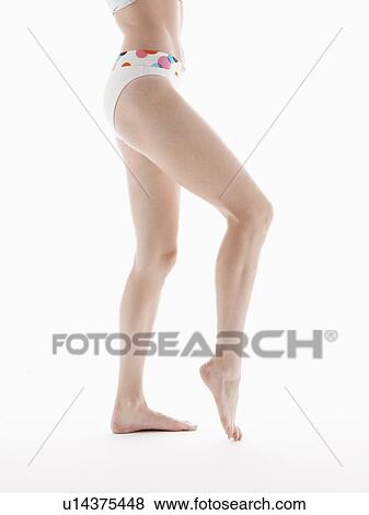Young woman in bikini bottoms (low section) View Large Photo Image Stock Photo - Young woman in bikini bottoms (low section). Fotosearch