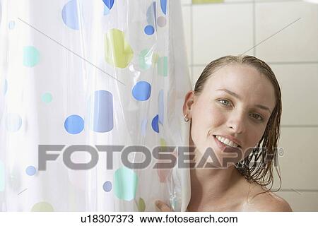 Stock Image - Young woman in shower (portrait). Fotosearch
