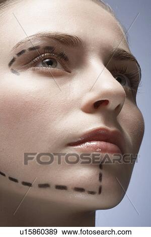 Stock Photo - Dotted lines on woman's face. Fotosearch