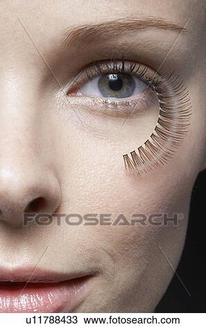 Fake eyelashes hanging from woman's eye, close-up View Large Photo Image Stock Image - Fake eyelashes hanging from woman's eye, close-up. Fotosearch