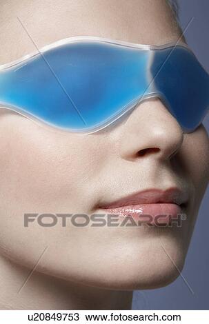 Young woman wearing eye mask View Large Photo Image Stock Image - Young woman wearing eye mask. Fotosearch