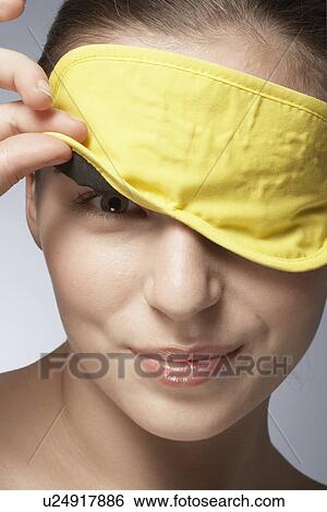 Young woman wearing sleep mask View Large Photo Image Stock Photograph - Young woman wearing sleep mask. Fotosearch
