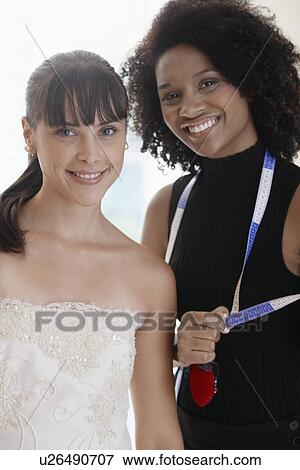 Bride and tailor (portrait) View Large Photo Image Stock Photo - Bride and tailor (portrait). Fotosearch