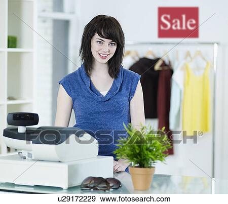 Sales Clerk in Clothes Store View Large Photo Image Stock Photo - Sales Clerk in Clothes Store. Fotosearch