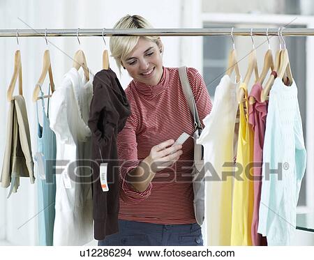Young Woman Shopping Clothes View Large Photo Image Picture - Young Woman Shopping Clothes. Fotosearch