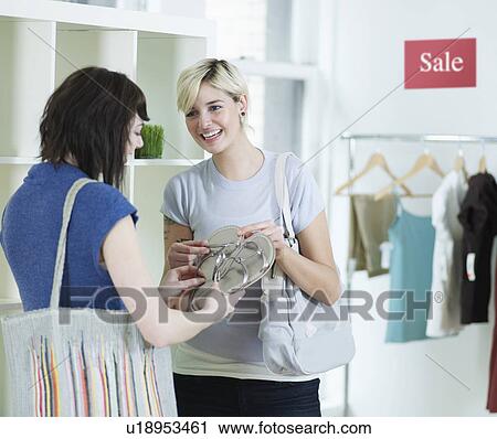 Young Women Shopping in Clothes Store View Large Photo Image Stock Image - Young Women Shopping in Clothes Store. Fotosearch