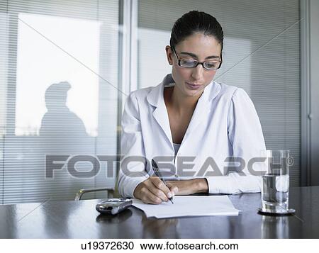 Businesswoman making notes View Large Photo Image Stock Image - Businesswoman making notes. Fotosearch